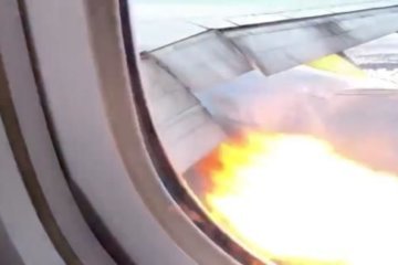 WATCH: A Boeing 777 lands safely back in Los Angeles after flames shoot from an engine
