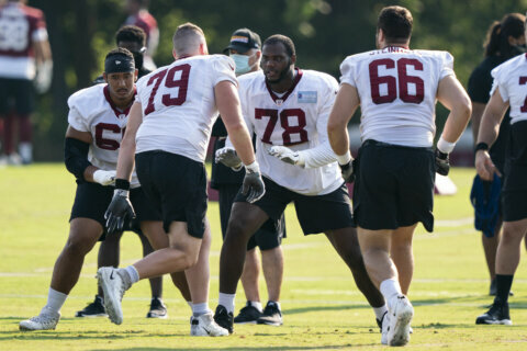 Commanders re-signing offensive tackle Cornelius Lucas, AP source says