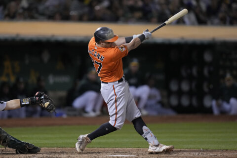 McCann has 2-out, 2-run single in 9th, Orioles emerge from 5-hour rain delay to beat Royals 4-3