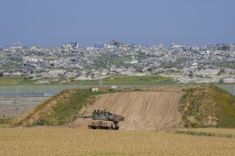 The Latest | Israel says it will reopen border crossing with hard-hit northern Gaza